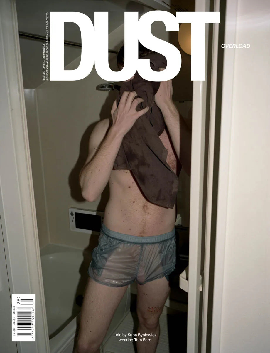 Simone Books DUST magazine issue 29 Overload cover featuring a man in translucent shorts holding a brown towel