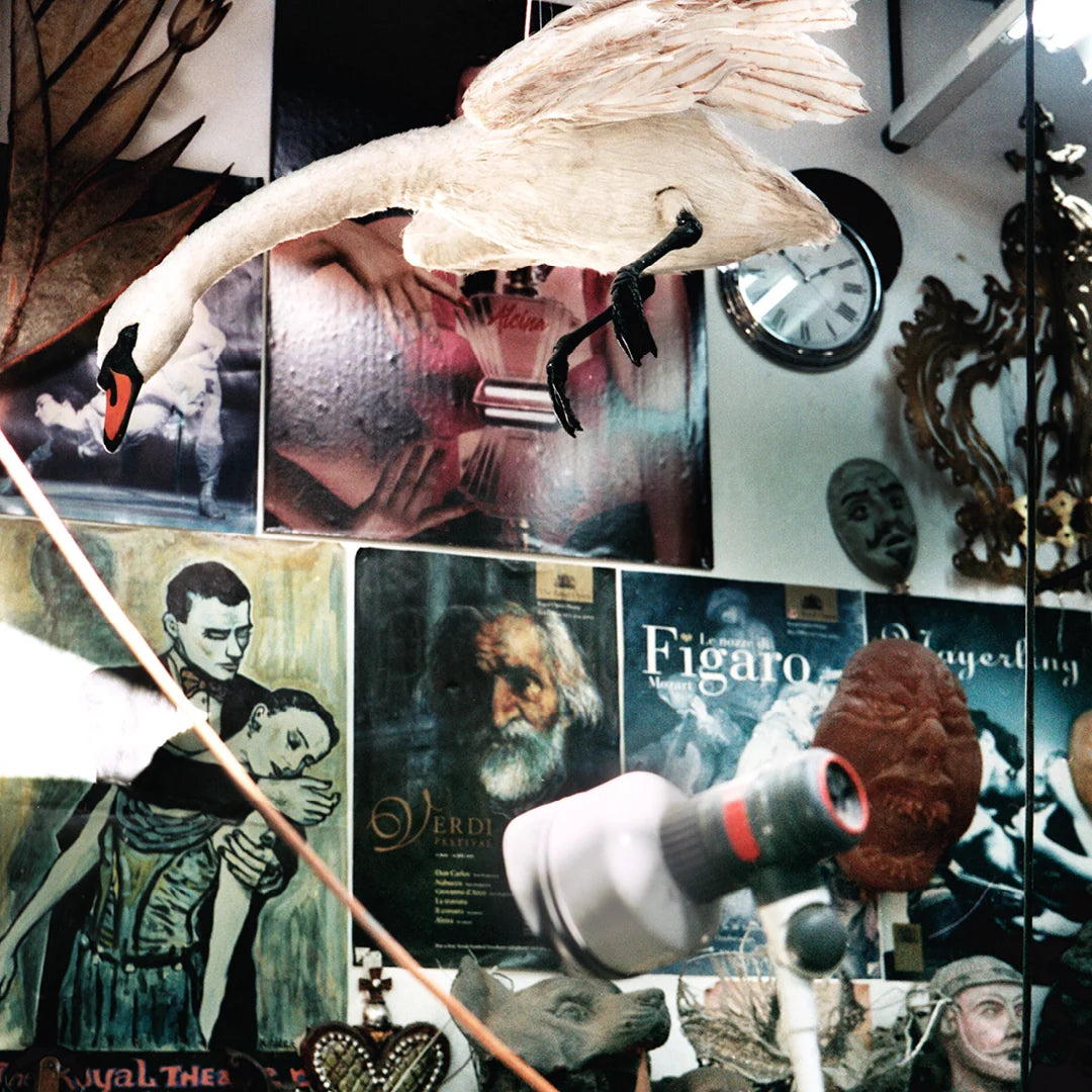 Simone Books Scenery Issue 5 magazine cover featuring a hanging swan sculpture in a cluttered artistic studio space
