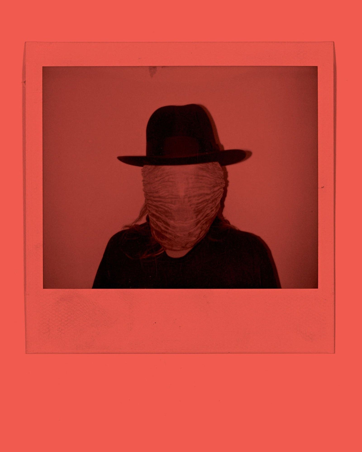 Simone Books Dash Snow zine page featuring a black and white Polaroid of a person in a hat with a covered face