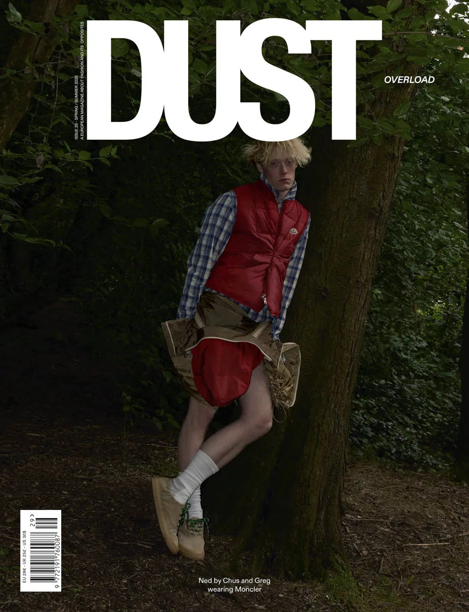 Simone Books DUST magazine issue 29 Overload featuring a model in a red vest and plaid shirt leaning against a tree.