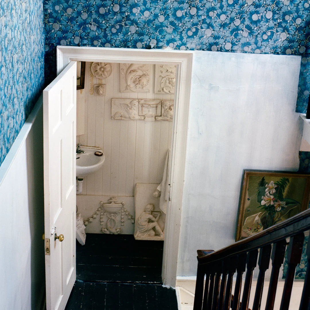 Simone Books Scenery Issue 5 magazine featuring interior photography of a blue floral room and white plaster details.